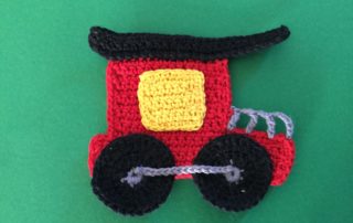 Finished crochet train caboose landscape