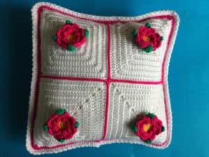 Finished cushion with joined granny squares landscape