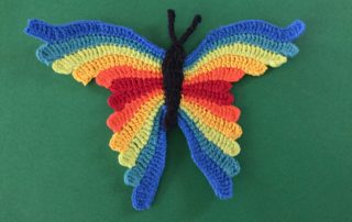 Finished crochet butterfly green background landscape