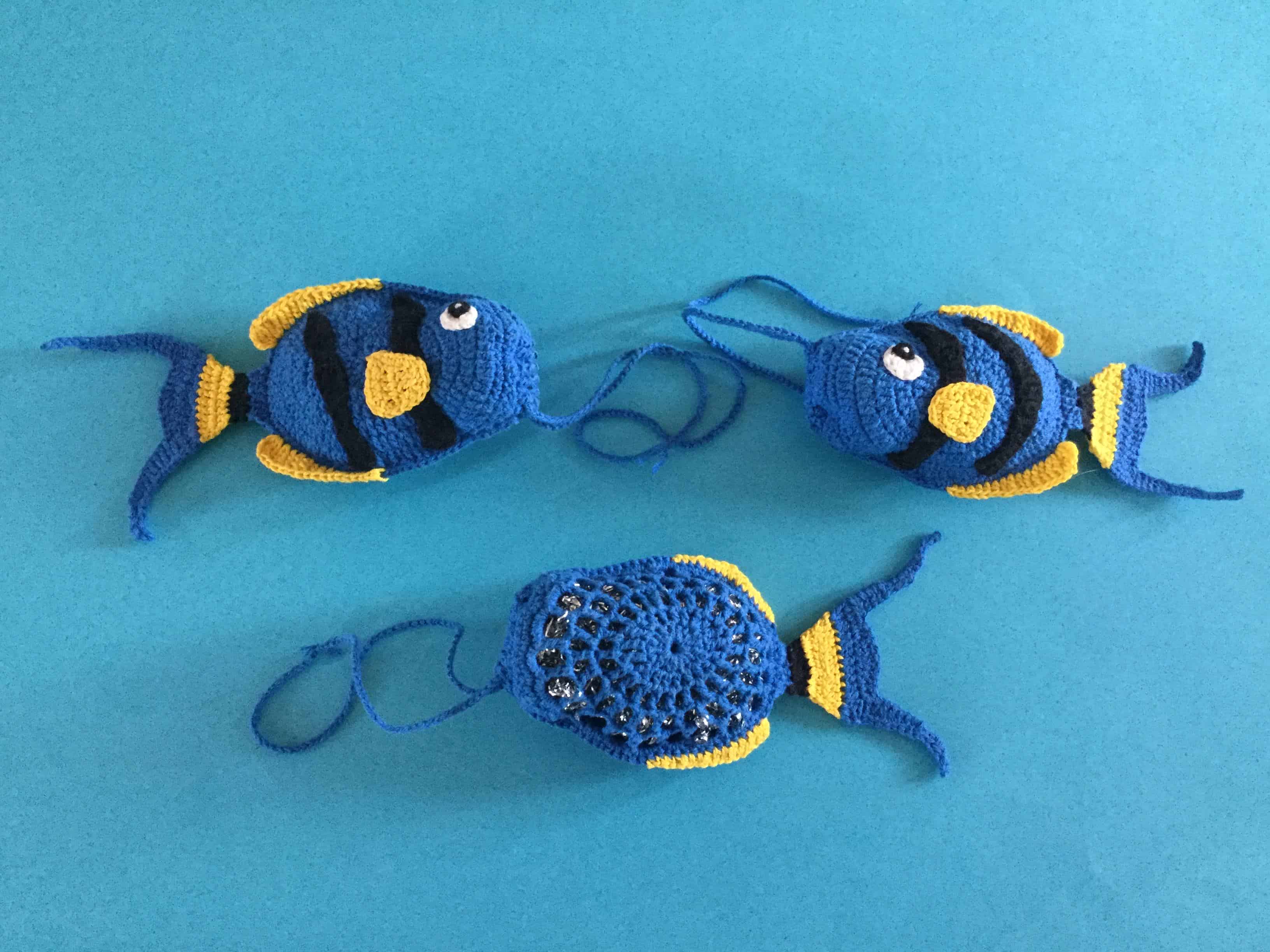 Finished crochet fish scrubbie group landscape