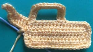 Crochet digger back arm