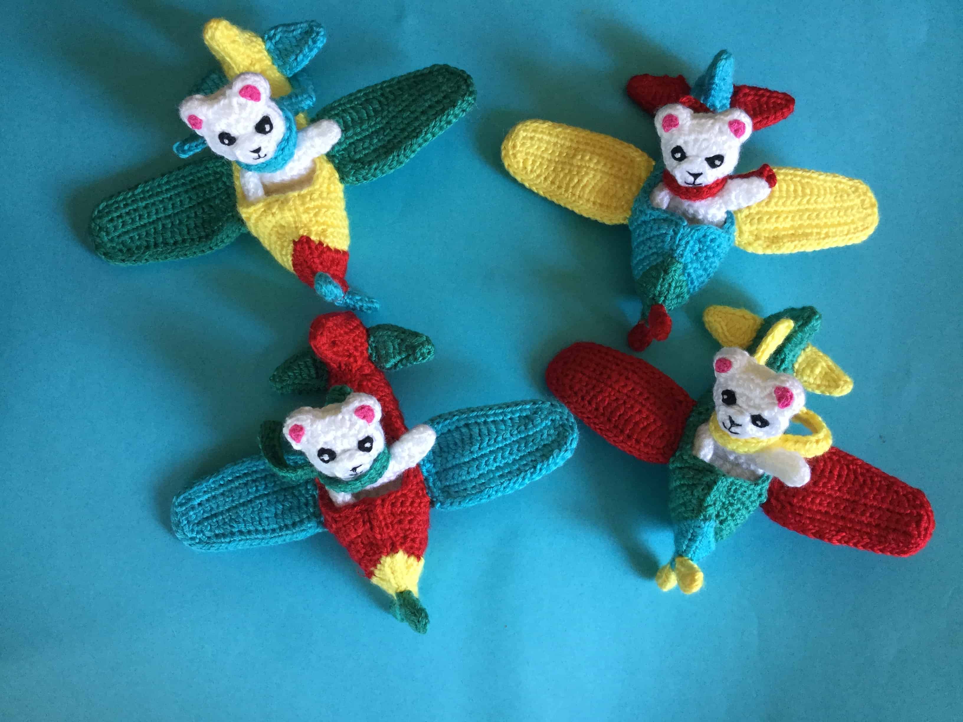 Finished crochet teddy for plane mobile in plane group landscape