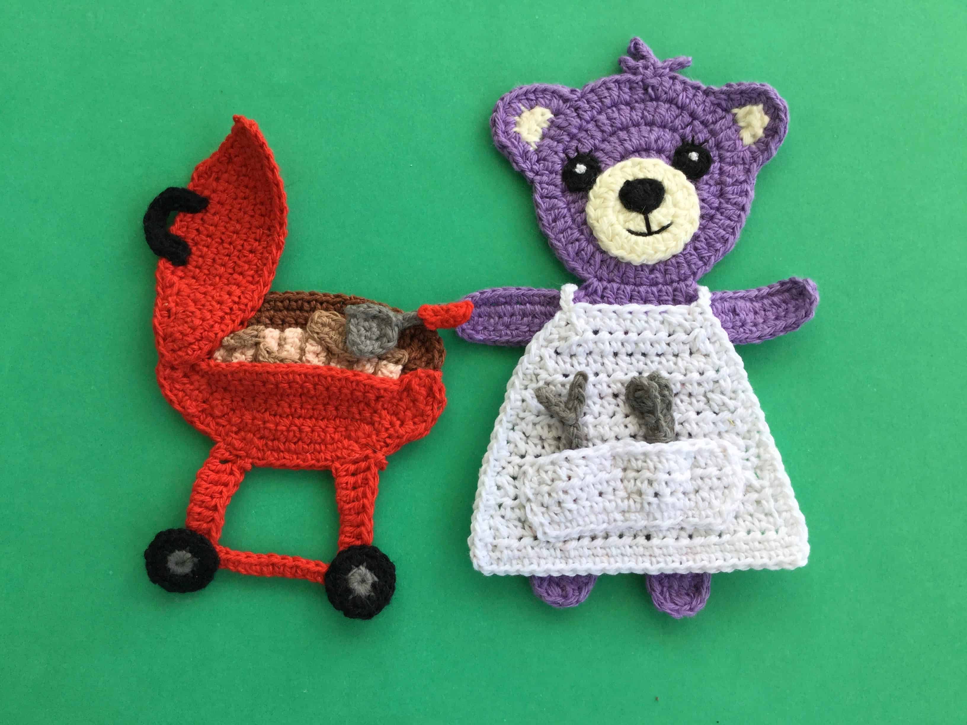 Finished crochet barbecue apron with barbecue and teddy landscape
