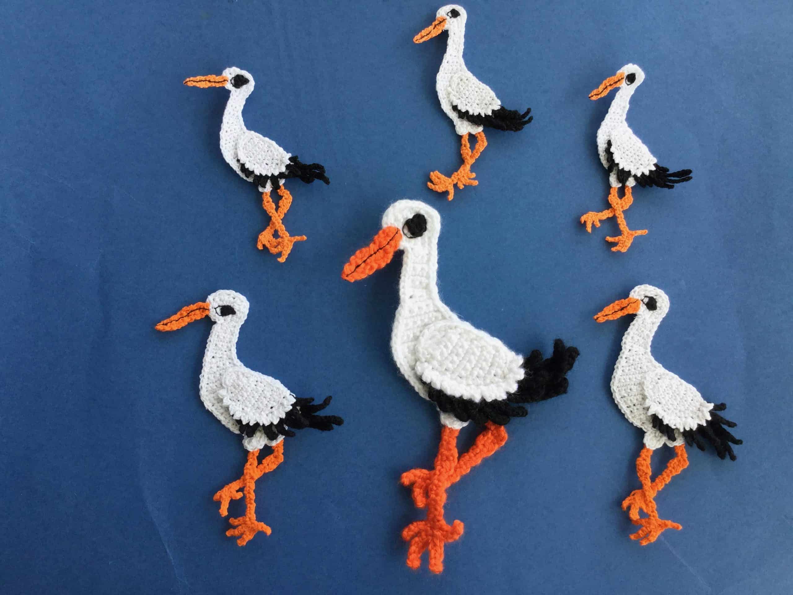 Finished crochet stork 2 ply group dark blue background landscape