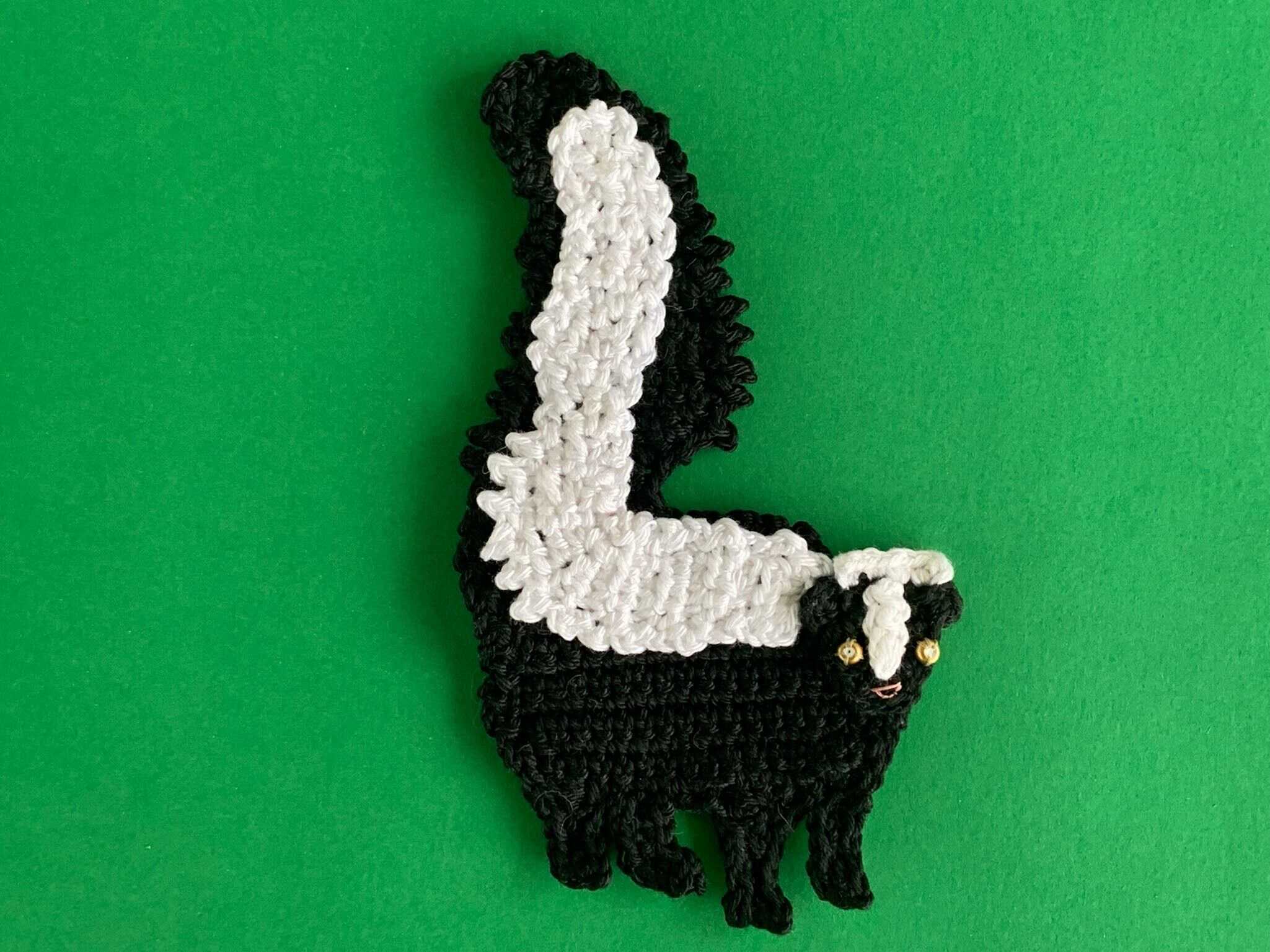 Finished crochet skunk 4 ply landscape