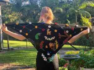 Finished crochet shawl tutorial with model landscape