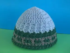 Finished train track beanie tutorial green and blue background landscape