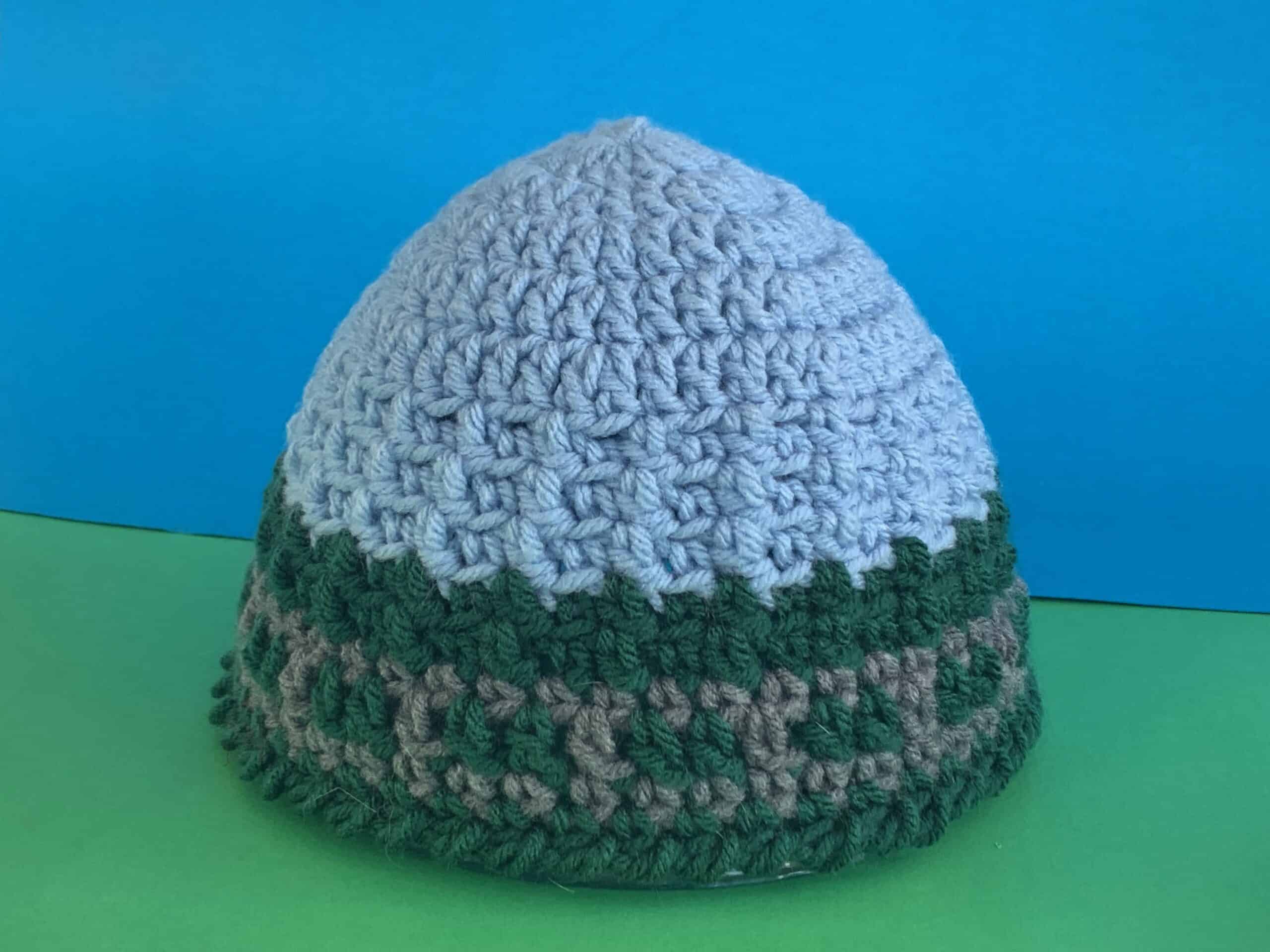 Finished train track beanie green and blue background landscape