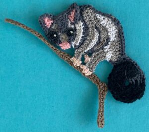 Crochet gumnut 2 ply possum on branch