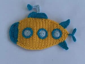 Finished crochet submarine 2 ply landscape white background