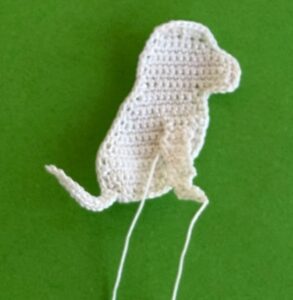 Crochet dalmatian pup 2 ply near front leg