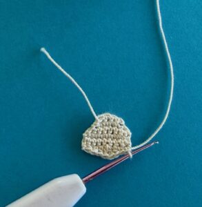 Crochet sitting hedgehog 2 ply face